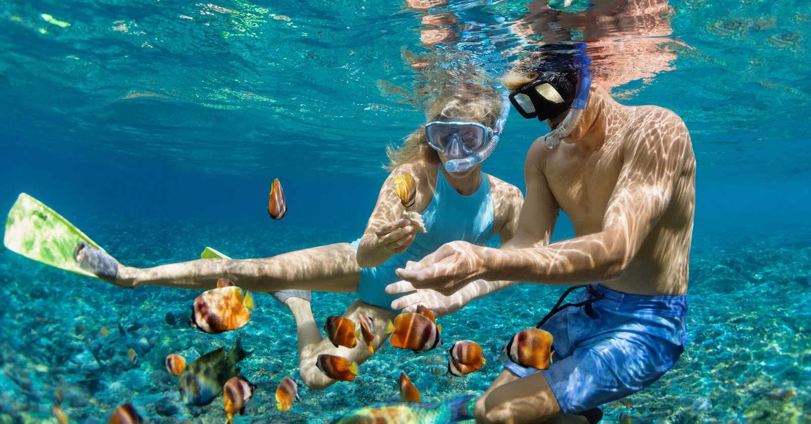 boy and girl snorkeling at el cielo reef in cozumel